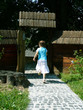 the girl running out from a court yard
