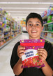 boy begging for candy (generic candy bag)