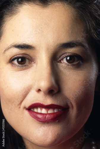 Photo: tight head shot of attractive business woman tight head shot of attractive business woman