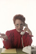 Photo: business woman with telephone in office business woman with telephone in office