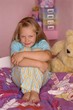 little girl in her pink room