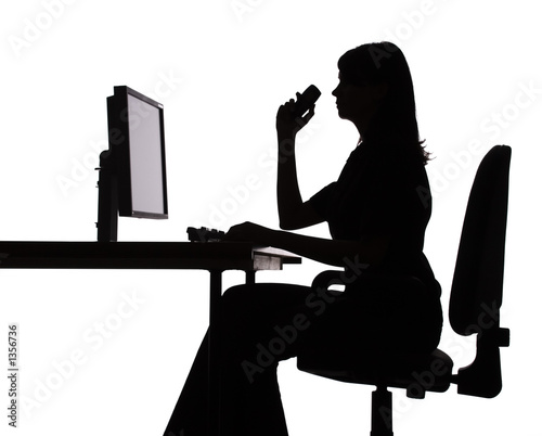 silhouette of woman working computer (phone)