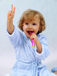 happy girl brushing teeth