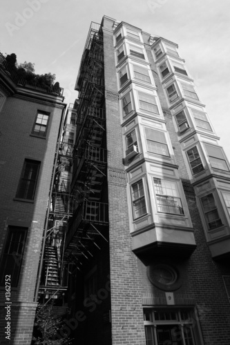 Photo: tall building with fire escape and bay windows tall building with fire escape and bay windows