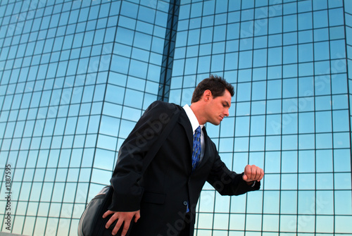 Photo: businessman checking watch businessman checking watch
