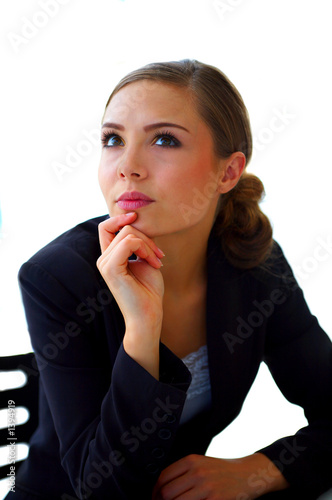 Photo: young businesswoman wondering young businesswoman wondering