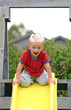 boy on top of slide