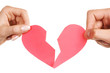 man woman hands holding broken heart