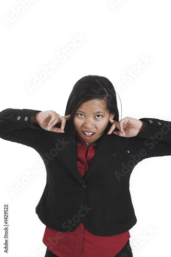 Photo: woman plugging her ears woman plugging her ears