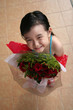 Photo: girl holding bouquet of red roses girl holding bouquet of red roses