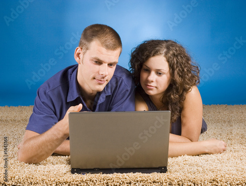 young couple on beige carpet