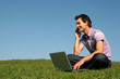 young man using a laptop outdoors young man using a laptop outdoors
