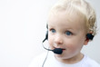 Foto: young boy wearing telephone headset young boy wearing telephone headset
