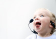 Foto: young boy wearing telephone headset young boy wearing telephone headset