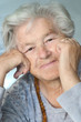 elderly woman leaning on hands elderly woman leaning on hands