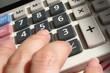 calculator and hand
