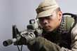 desert camo army soldier aiming desert camo army soldier aiming