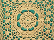 hand crocheted lace with green background