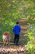 boy walking with dog