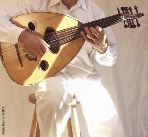 arab musician playing traditional stringed instrum