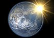earth globe facing asia with sun halo