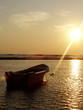 boat on sea at sunset