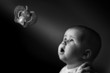 baby is watching toy butterfly