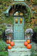 front door with ivy and pumpkins