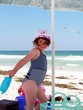 child playing at the beach