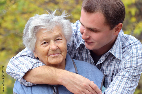 hugging elderly person