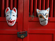 fox masks on red shrine doors