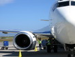 2 ground crew loading an airplane 2 ground crew loading an airplane