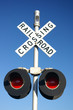 railroad crossing sign with lamps