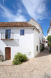 narrow, cobbled streets and houses of spanish pueblo