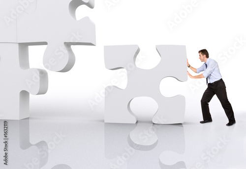 business man building a puzzle