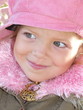 little girl in pink cap