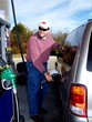 man pumping gas