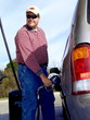 man pumping gas