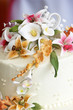 beautiful flowers on top of a wedding cake