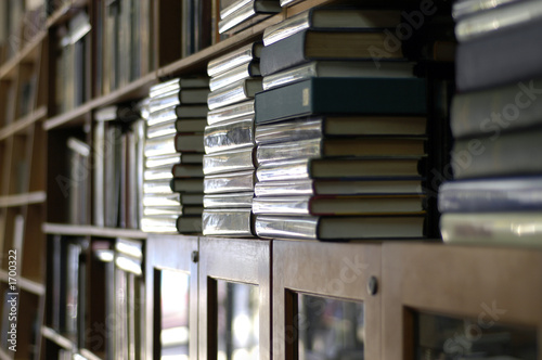 Photo: bookshelves piled with books bookshelves piled with books