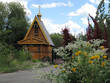 orthodox wooden chapel with a campanile and the gilt dome 3