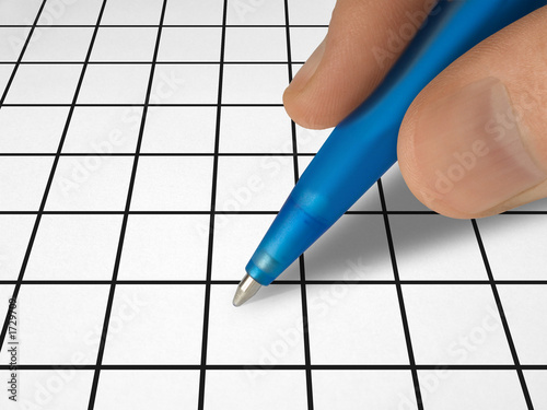 Photo: pen in hand and crossword pen in hand and crossword
