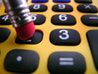 crunching the numbers on the calculator
