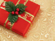 red christmas gift box with gold ribbon