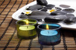 candles before black pebbles