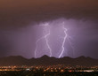 Photo: lightning over the city and mountains lightning over the city and mountains