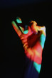 human hand in the coloured light