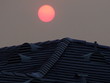 sunset over roof sunset over roof