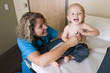 Photo: female medical professional checking childs heart female medical professional checking childs heart