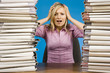 overworked woman at the office desk